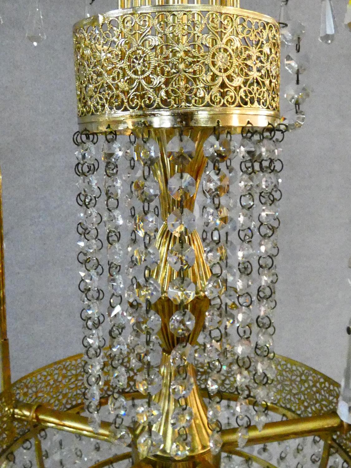 A pair of gilt metal five branch chandeliers with crystal drops. H.80 D.44cm - Image 4 of 10