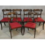 A set of six Regency mahogany bar back dining chairs with shell carving to the backs above drop in