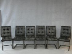 A set of six buttoned faux leather dining chairs on chrome cantilever bases. H.94cm