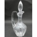Three antique cut and engraved blown glass decanters. A pair with engraved vine design and bell