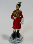 A Michael Sutty hand painted porcelain figure, The Governor's Bodyguard Madras. H.30cm