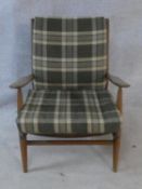 A mid century Scandart Danish teak framed salon armchair. With makers label. H.73cm