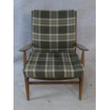 A mid century Scandart Danish teak framed salon armchair. With makers label. H.73cm