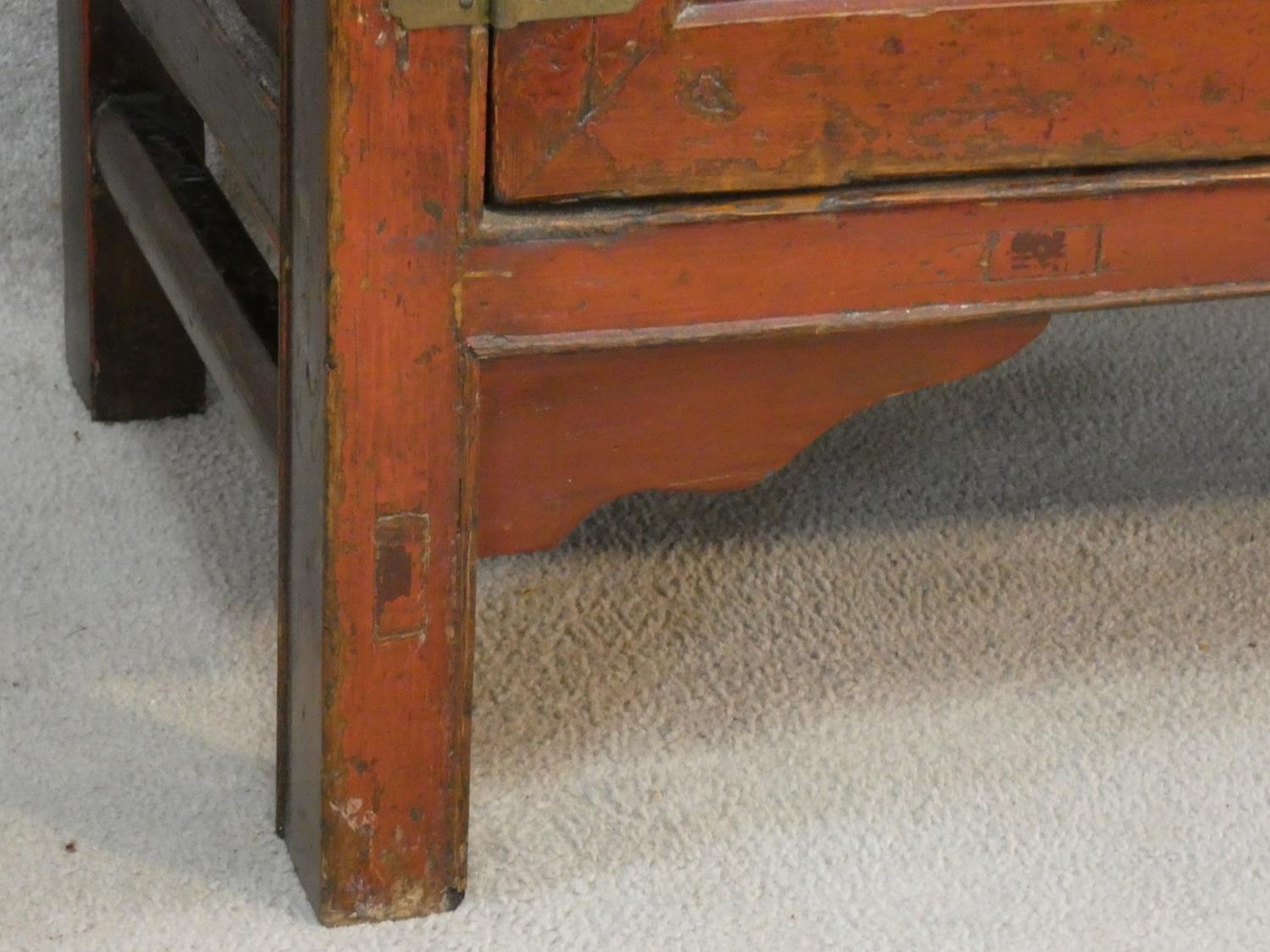 A Chinese hardwood and brass bound side cabinet with frieze drawers above a pair of panel doors on - Image 6 of 6