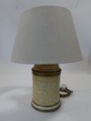 A John Lewis paper effect ceramic cylindrical table lamp with calligraphy and gilded details. Makers