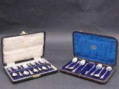 A cased set of eight silver teaspoons and a cased set of six silver teaspoons and sugar tongs with