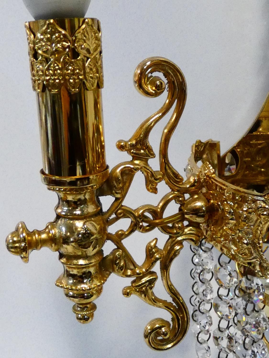 A set of six gilt metal twin branch wall candelabras with crystal drops. H.38cm - Image 8 of 9