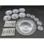 A collection of antique cut crystal items. Including a set of fourteen star cut knife rests, a