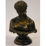 An antique bronzed plaster bust of a classical style woman on stepped carved ebonised circular base.