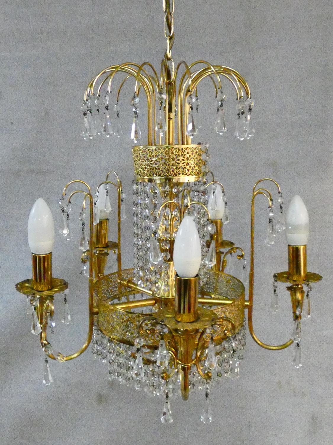 A pair of gilt metal five branch chandeliers with crystal drops. H.80 D.44cm - Image 2 of 10