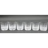 A set of six cut crystal tumblers with abstract design and star cut bases. H.7.5 D.7cm