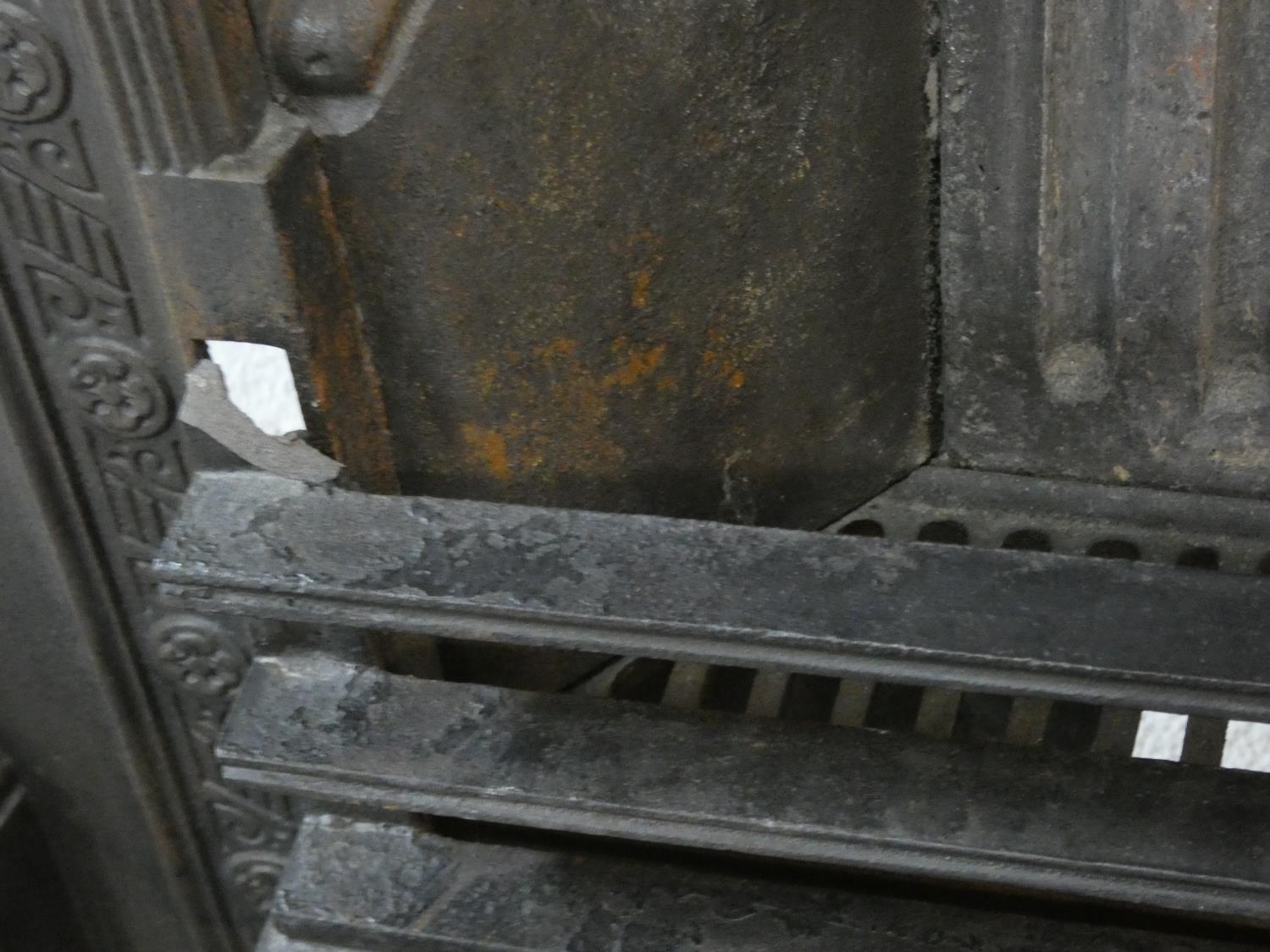 An ornately cast 19th century iron fire surround, mantel shelf and insert with grate on marble - Image 9 of 12