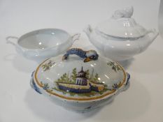Three ceramic soup tureens. One hand painted French Faience tureen painted with buildings and