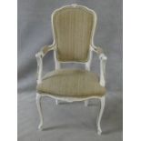 A set of eight Louis XV style distressed painted and gilt dining chairs in fawn upholstery on