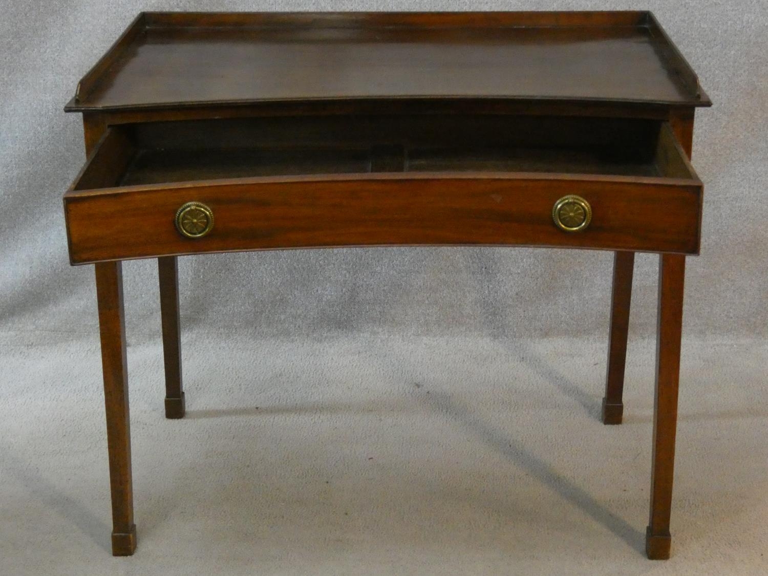 A 19th century mahogany writing table of concave outline fitted with frieze drawer on square - Image 2 of 4