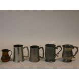 A miscellaneous collection of five 19th century and later pewter and copper tankards. H.13cm