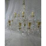 A large Czech crystal glass and brass mounted chandelier with eighteen twisted glass stem