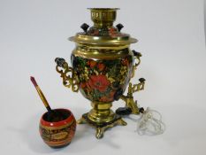 A vintage electric hand painted brass Russian samovar. With fruit and floral design and scrolling