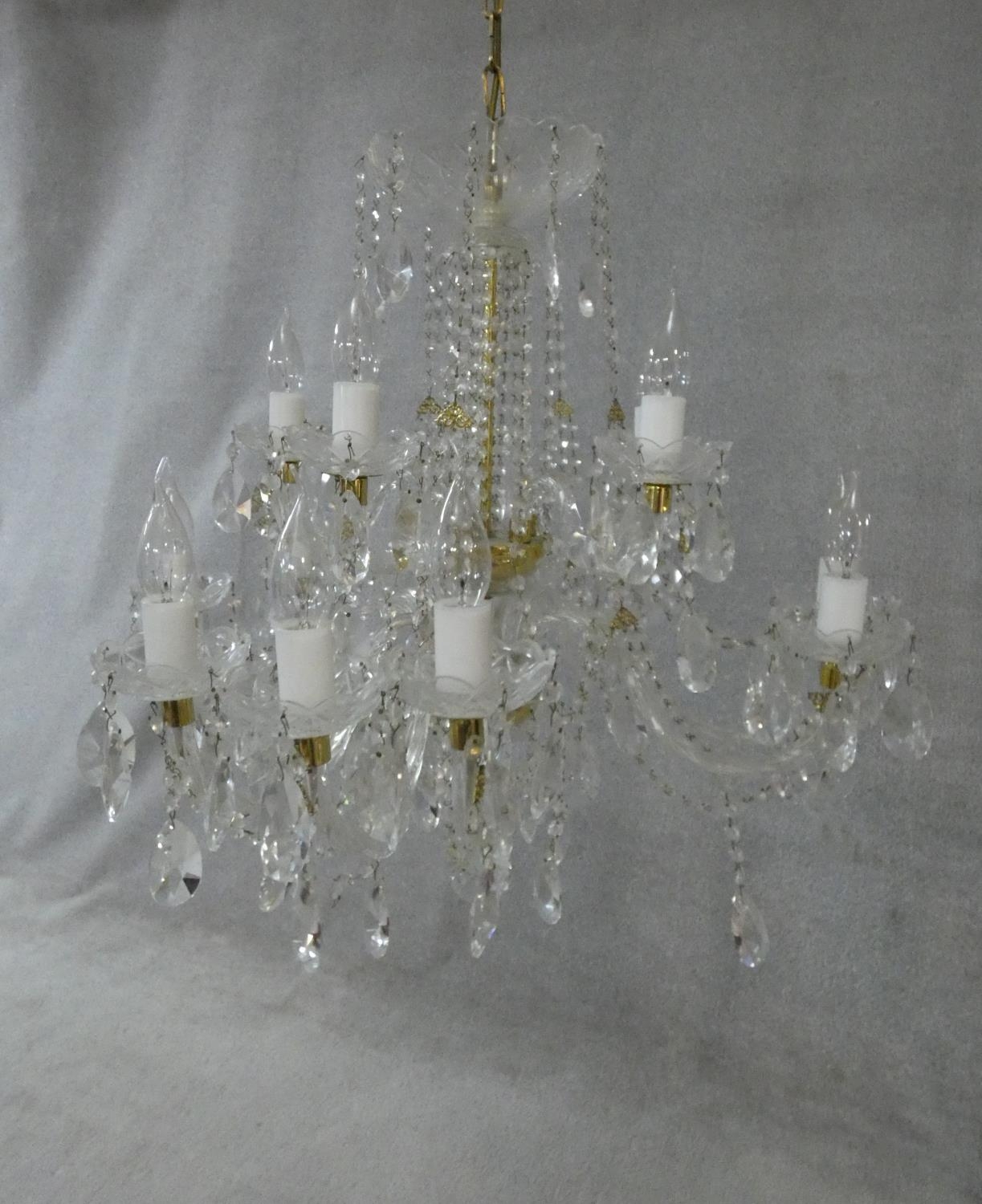 A large Czech crystal glass and brass mounted chandelier with fifteen twisted glass stem branches, a