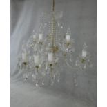 A large Czech crystal glass and brass mounted chandelier with fifteen twisted glass stem branches, a