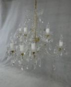 A large Czech crystal glass and brass mounted chandelier with fifteen twisted glass stem branches, a