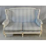 A Louis XVI style gilt and with painted two seater sofa in pale damask upholstery. H.93 L.136 D.77cm