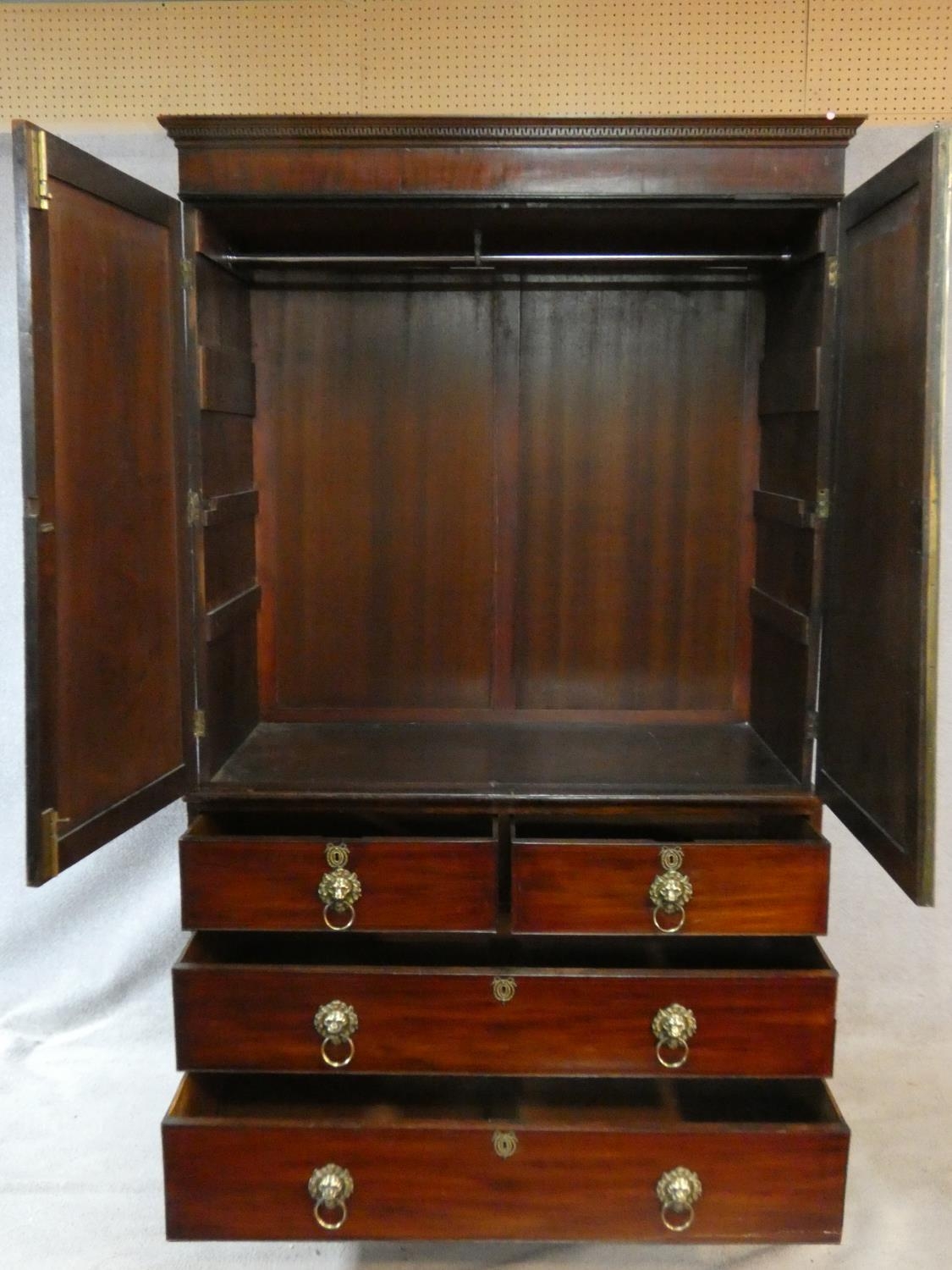 A Regency mahogany linen press with stepped dentil cornice above panel doors enclosing interior - Image 2 of 5