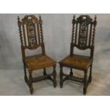 A pair of late 19th century Carolean style hall chairs with carved backs and panel seats on