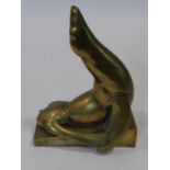 Georg Roch (1881-1943), a brass figure of a seal on a plinth, signed. H.27 L.21 W.13cm