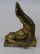 Georg Roch (1881-1943), a brass figure of a seal on a plinth, signed. H.27 L.21 W.13cm