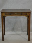 A Georgian mahogany lamp table fitted with frieze drawer on square chamfered supports. H.71 W.71 D.