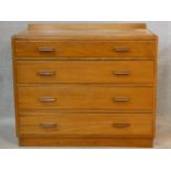 A mid century teak chest of four long drawers on plinth base. H.78 W.91 D.48cm