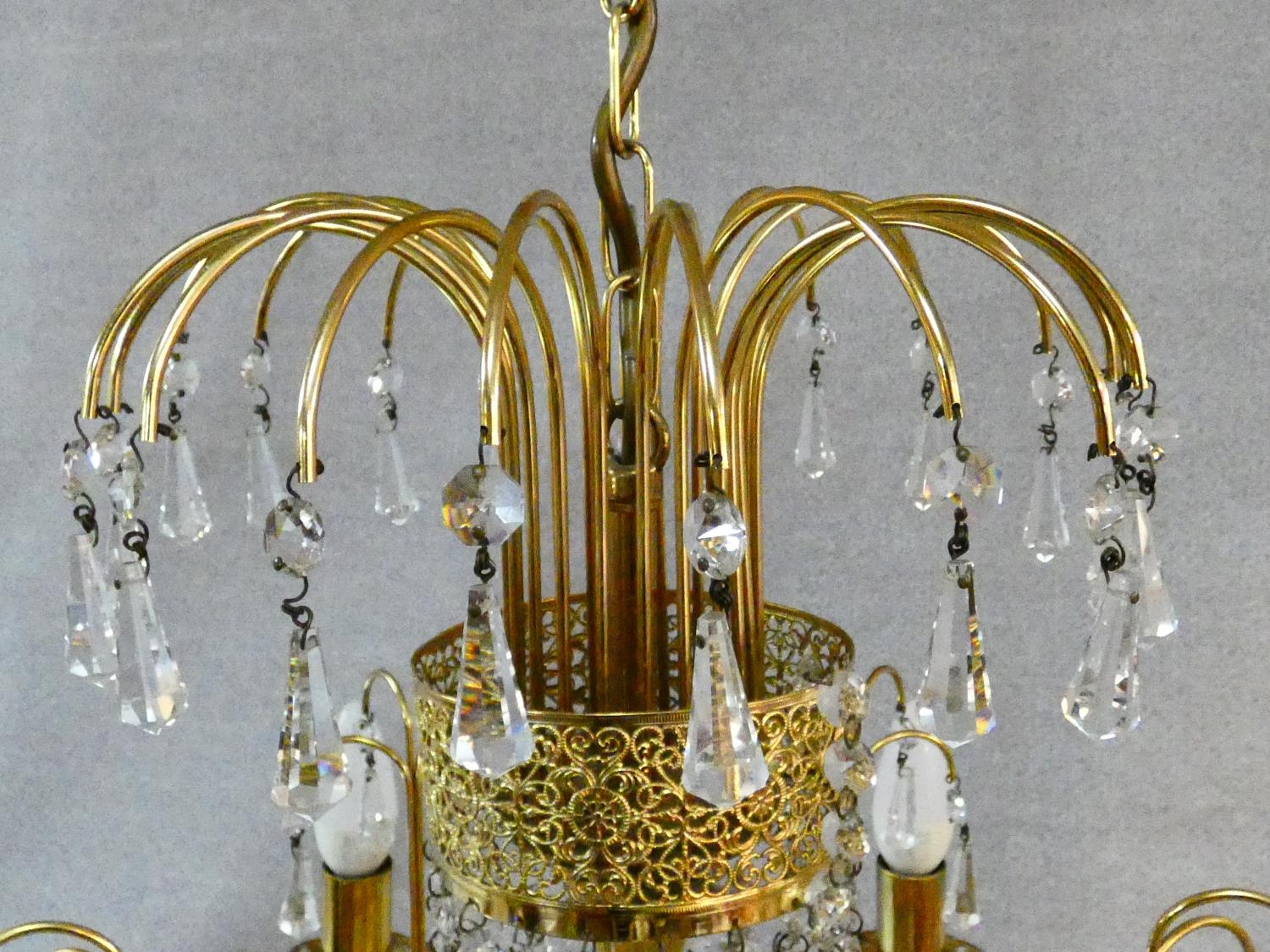 A pair of gilt metal five branch chandeliers with crystal drops. H.80 D.44cm - Image 3 of 10
