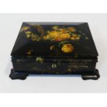 A Victorian lacquered, gilded, painted and mother of pearl inlaid jewellery/stationery box.