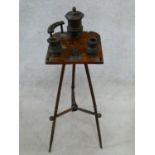 A late 19th century walnut smoker's stand with treen fittings and hand painted floral decoration.