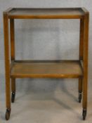 A vintage oak two tier trolley on casters. H.79 L.60 W.41cm