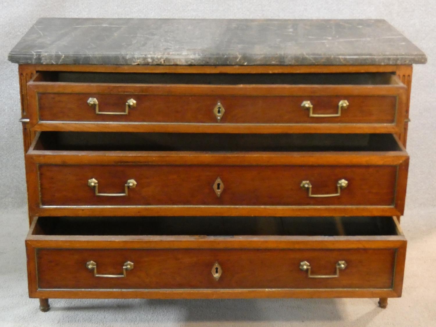 A late 19th century French walnut marble topped commode with three long drawers, brass handles and - Image 2 of 5