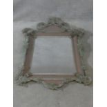 A Venetian style pier mirror set within a blush glazed frame with all over applied floral