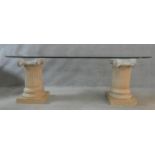 A twin pedestal dining table with plate top on terracotta Corinthian column supports. H.74 W.221 D.