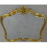 A contemporary shaped gilt frame wall mirror with Rococo shell cresting. H.75 W.102cm