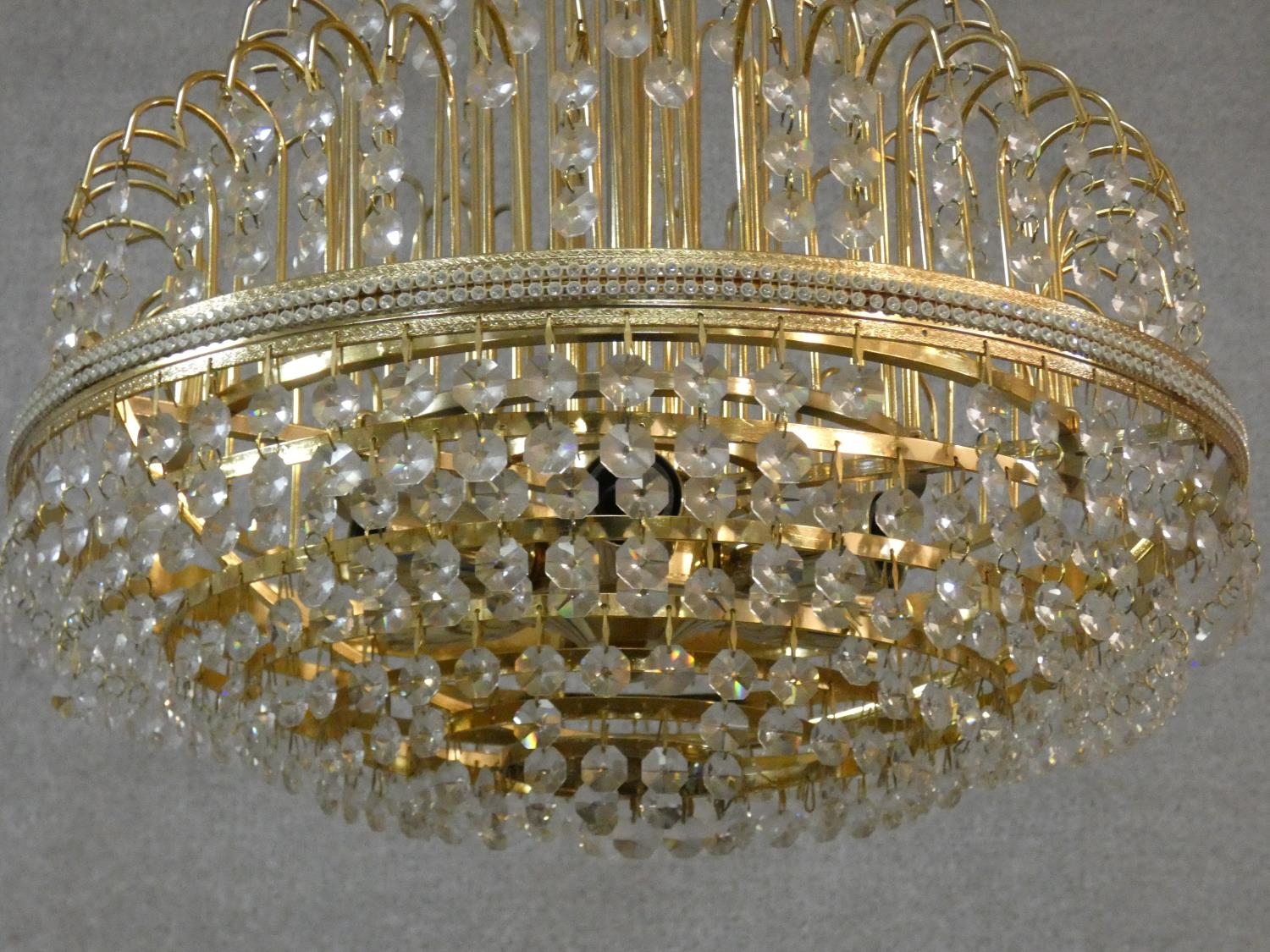 A brass framed four tier wedding cake style chandelier with crystal drops. H.50 D.43cm - Image 3 of 4