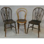 A pair of Windsor wheelback dining chairs and a vintage bentwood cafe chair. H.93cm