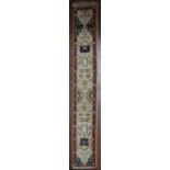 An Agra design runner with all over scrolling meandering stylised foliate decoration within floral