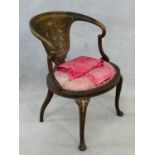 A late 19th century mahogany tub armchair with satinwood and ivory inlay on cabriole supports. H.