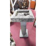 A concrete birdbath on fluted classical column pedestal. H.93 D.43cm