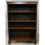 A Georgian style flame mahogany and crossbanded dwarf open bookcase on shaped bracket feet. H.122