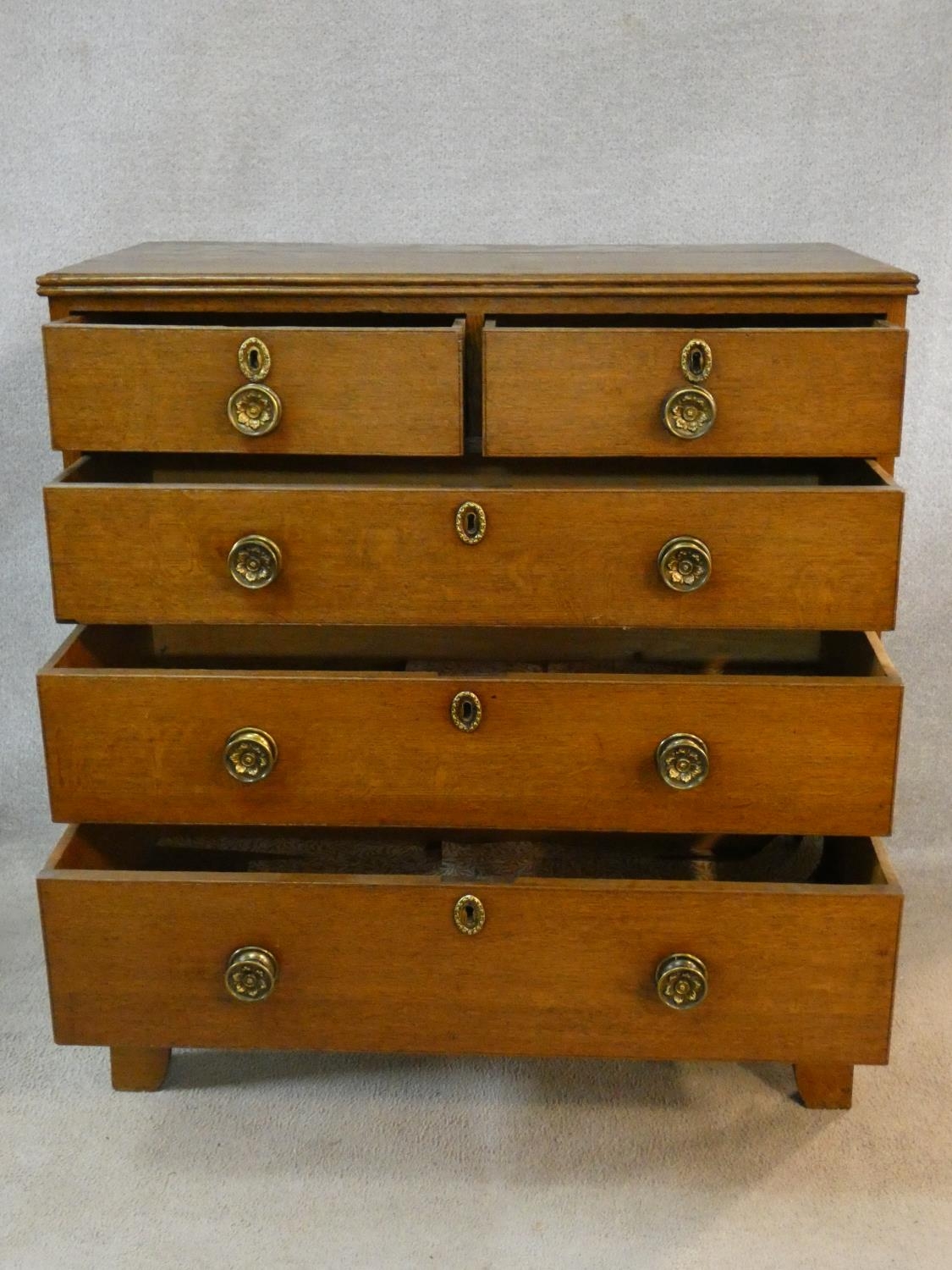 An early 19th century light oak chest of two short over three long drawers fitted with original - Image 3 of 8