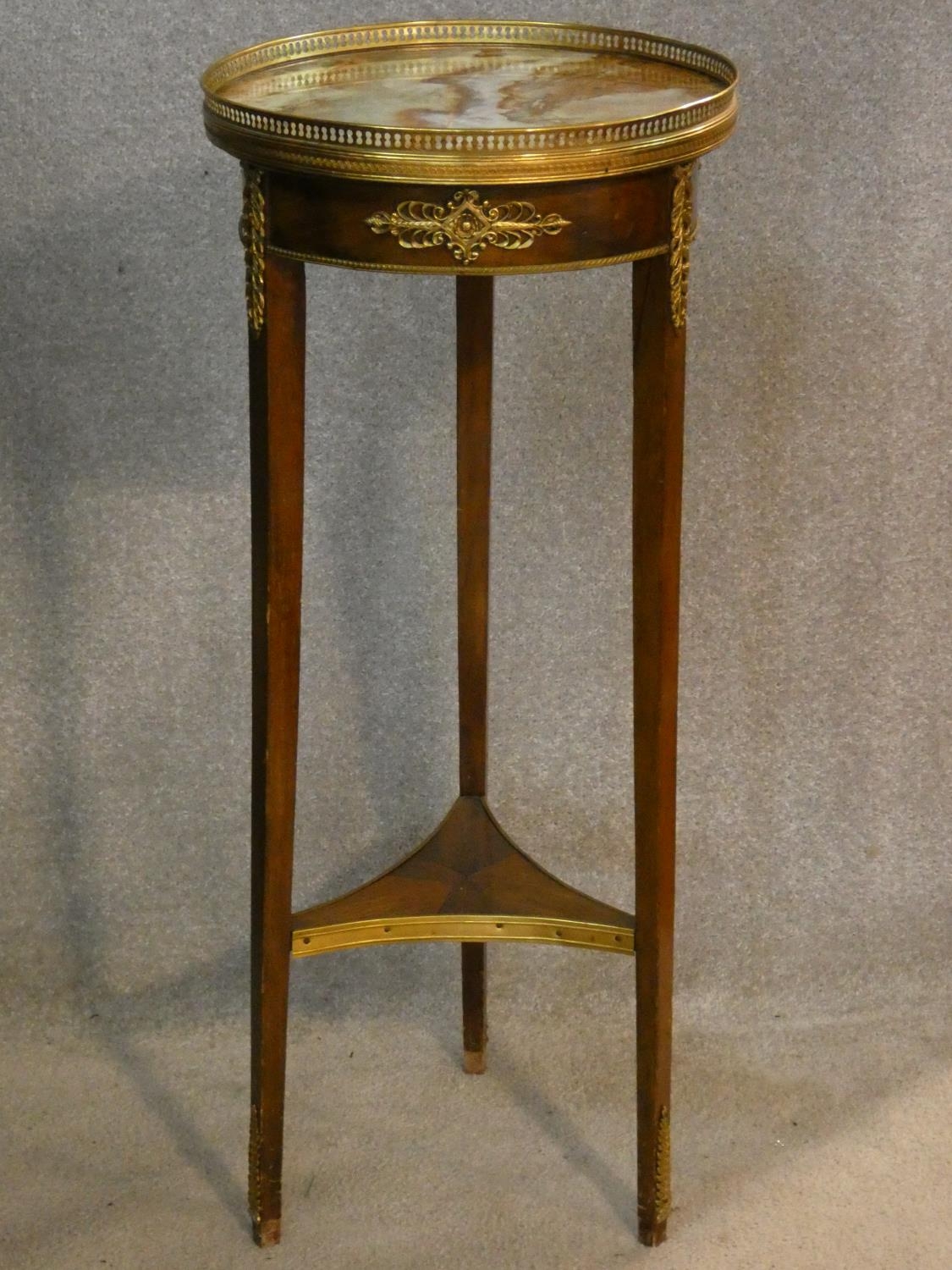 A 19th century French Empire ormolu mounted urn stand with brass galleried marble top on tapering