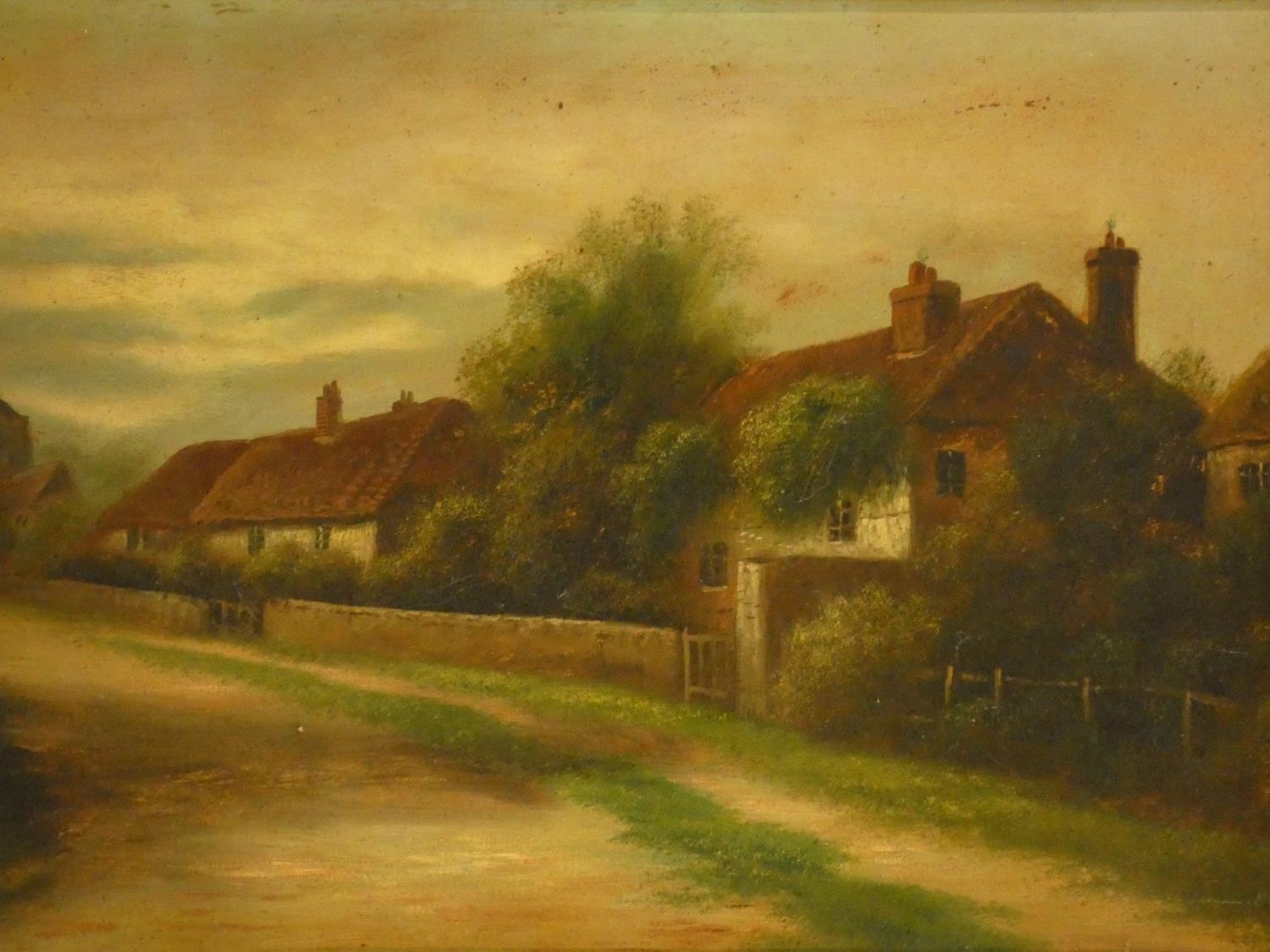 A 19th century gilt framed oil on board, rural village scene. H.51 W.71cm