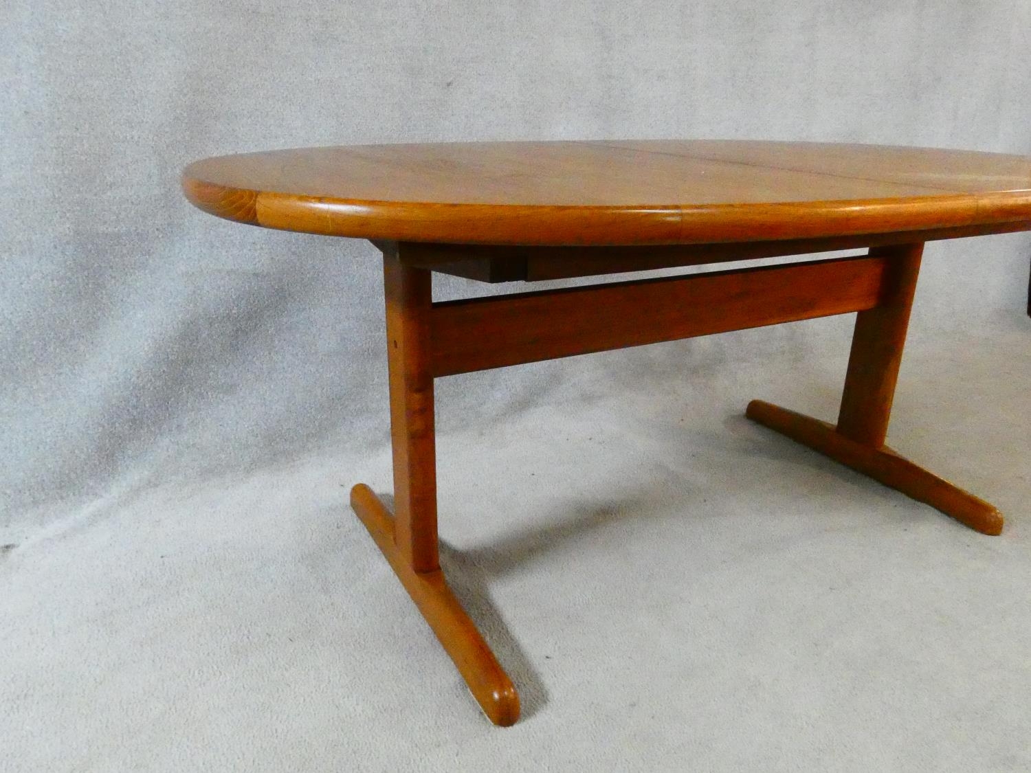 A 1960's vintage teak extending dining table on trestle style supports with extra leaf. H.72 L.167 - Image 5 of 9